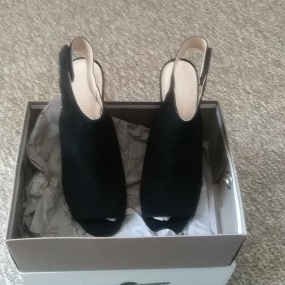 New without tags black pumps. In box.